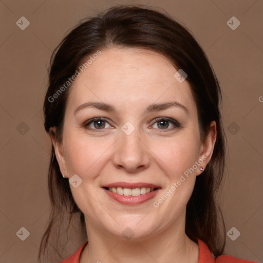 Joyful white adult female with medium  brown hair and grey eyes