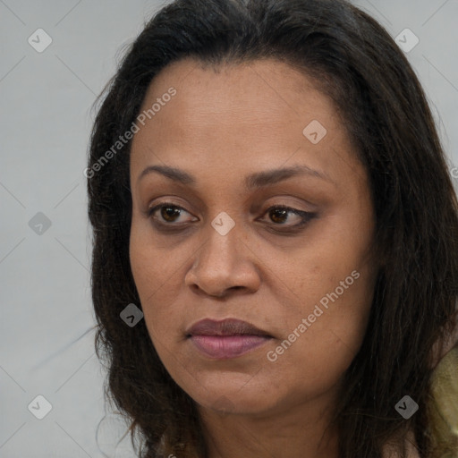 Joyful white adult female with long  brown hair and brown eyes
