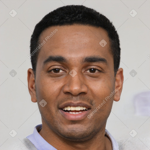 Joyful black young-adult male with short  black hair and brown eyes