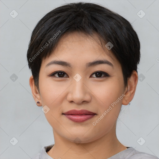 Joyful asian young-adult female with short  brown hair and brown eyes