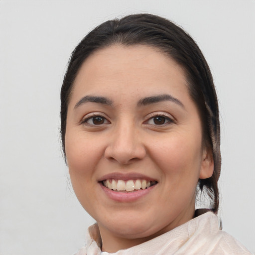 Joyful latino young-adult female with medium  brown hair and brown eyes