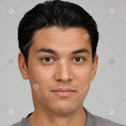 Joyful white young-adult male with short  black hair and brown eyes