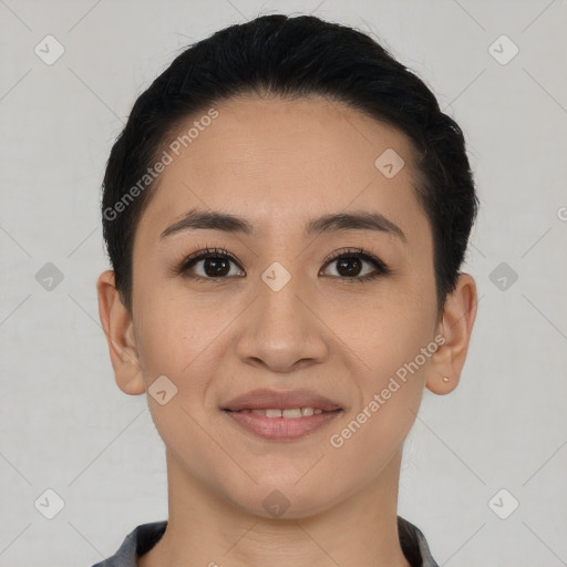 Joyful asian young-adult female with short  black hair and brown eyes