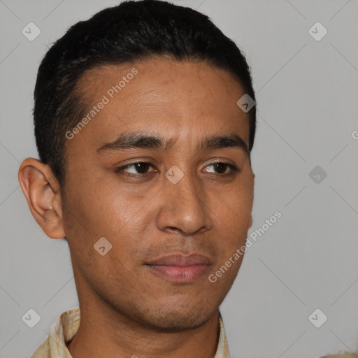 Neutral latino young-adult male with short  black hair and brown eyes