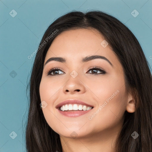 Joyful white young-adult female with long  black hair and brown eyes