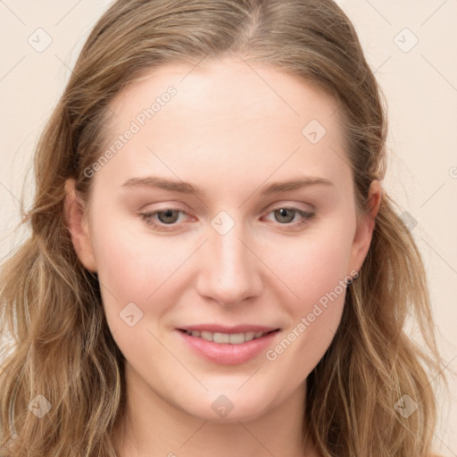 Joyful white young-adult female with long  brown hair and blue eyes