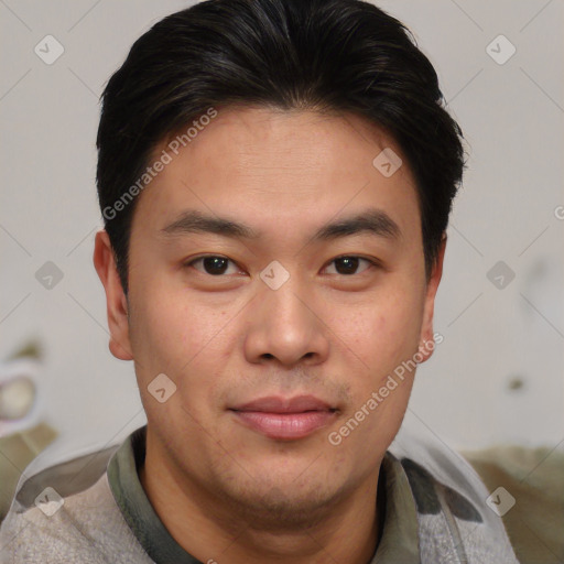 Joyful asian young-adult male with short  brown hair and brown eyes