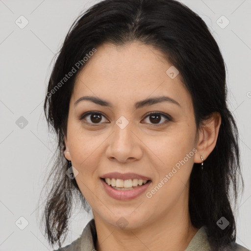 Joyful latino young-adult female with medium  brown hair and brown eyes