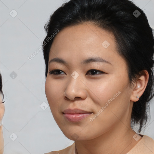 Joyful asian young-adult female with medium  brown hair and brown eyes