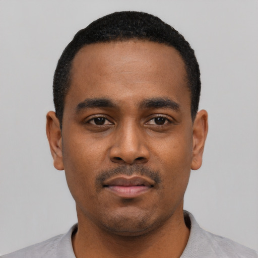 Neutral black young-adult male with short  black hair and brown eyes