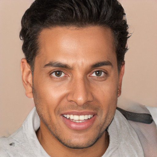 Joyful white adult male with short  brown hair and brown eyes