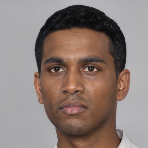 Neutral black young-adult male with short  black hair and brown eyes
