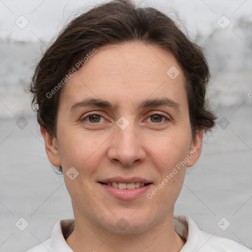 Joyful white adult female with short  brown hair and brown eyes