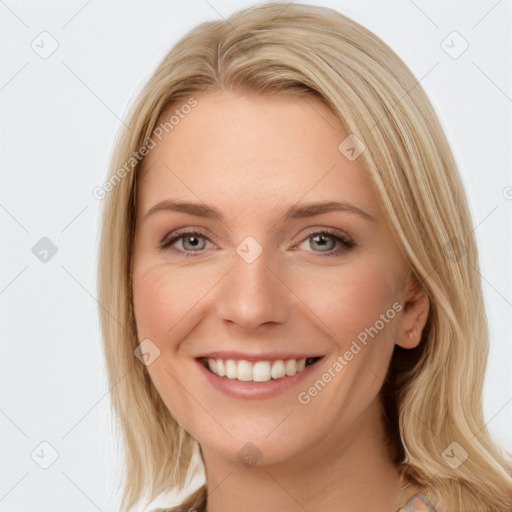 Joyful white young-adult female with long  brown hair and blue eyes