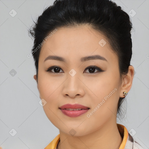 Joyful asian young-adult female with short  black hair and brown eyes