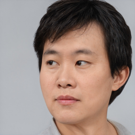 Neutral asian young-adult male with short  black hair and brown eyes