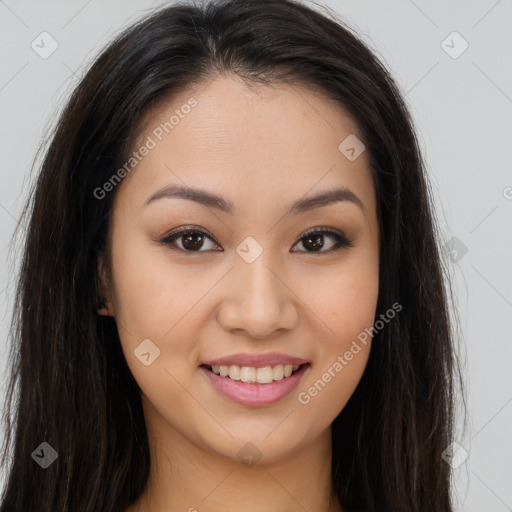 Joyful asian young-adult female with long  brown hair and brown eyes