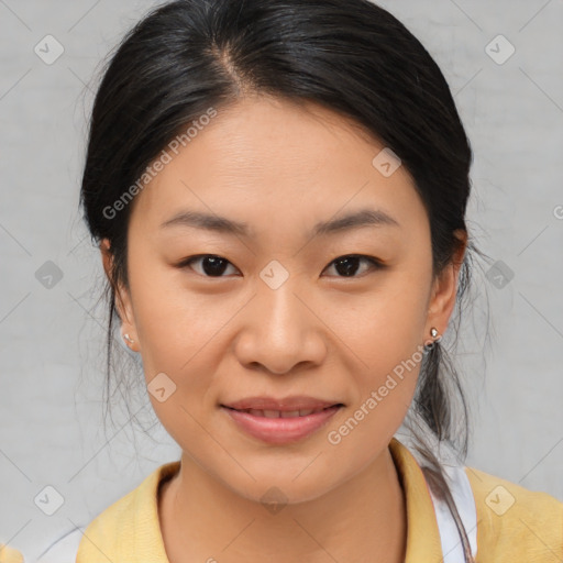 Joyful asian young-adult female with medium  brown hair and brown eyes