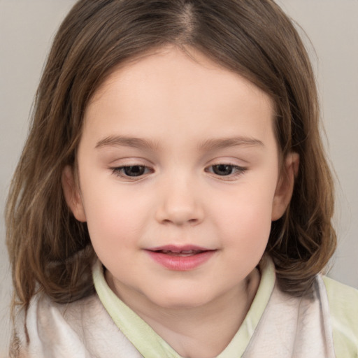 Joyful white child female with medium  brown hair and brown eyes