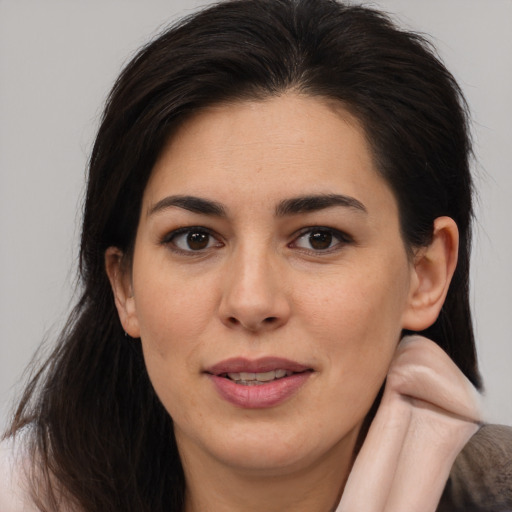 Joyful white young-adult female with medium  brown hair and brown eyes