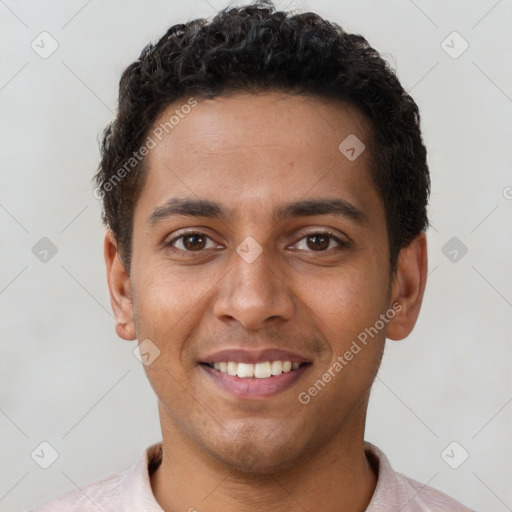 Joyful latino young-adult male with short  brown hair and brown eyes