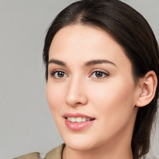 Joyful white young-adult female with medium  brown hair and brown eyes