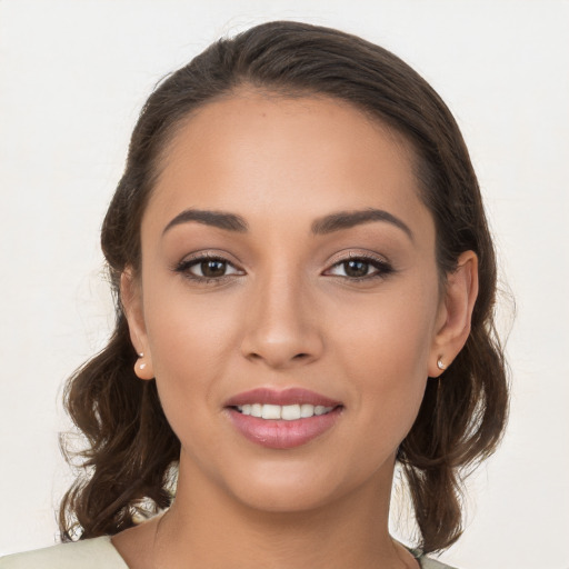 Joyful white young-adult female with medium  brown hair and brown eyes