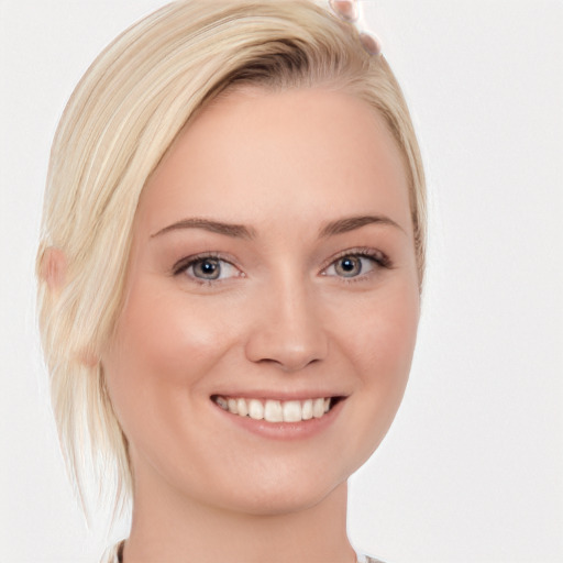 Joyful white young-adult female with medium  blond hair and blue eyes