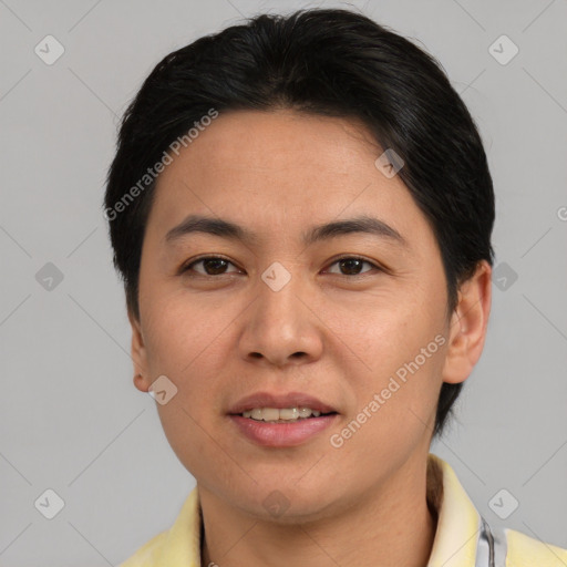 Joyful asian adult female with short  brown hair and brown eyes