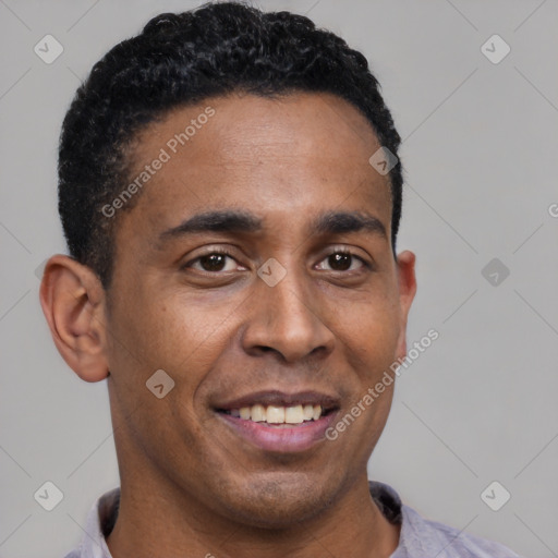Joyful latino young-adult male with short  brown hair and brown eyes