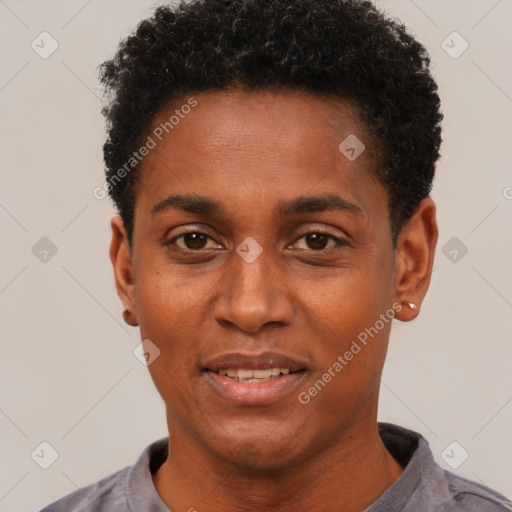 Joyful black young-adult male with short  black hair and brown eyes