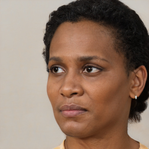 Neutral black young-adult female with short  black hair and brown eyes
