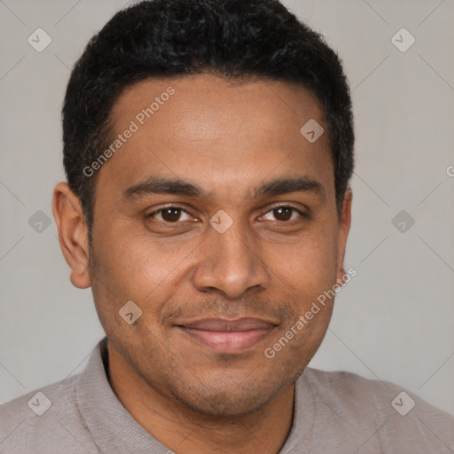 Joyful black young-adult male with short  brown hair and brown eyes