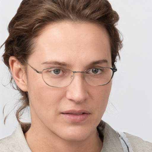 Joyful white adult female with short  brown hair and grey eyes