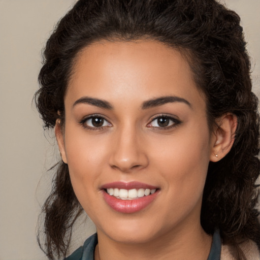 Joyful white young-adult female with long  brown hair and brown eyes