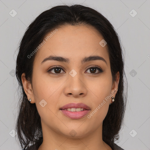 Joyful latino young-adult female with medium  brown hair and brown eyes