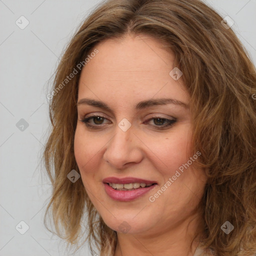 Joyful white adult female with long  brown hair and brown eyes