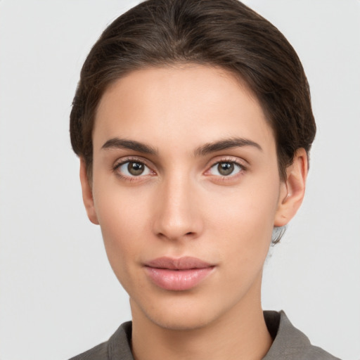 Neutral white young-adult female with short  brown hair and brown eyes