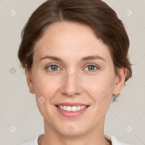 Joyful white young-adult female with medium  brown hair and green eyes