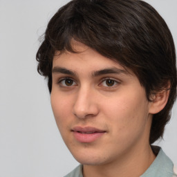 Joyful white young-adult male with medium  brown hair and brown eyes