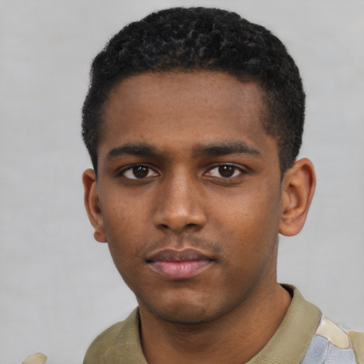 Neutral black young-adult male with short  black hair and brown eyes