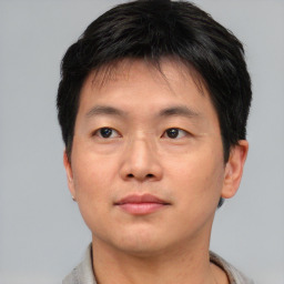 Neutral asian young-adult male with short  brown hair and brown eyes