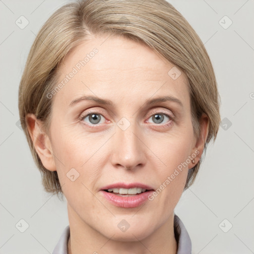 Joyful white adult female with medium  brown hair and blue eyes