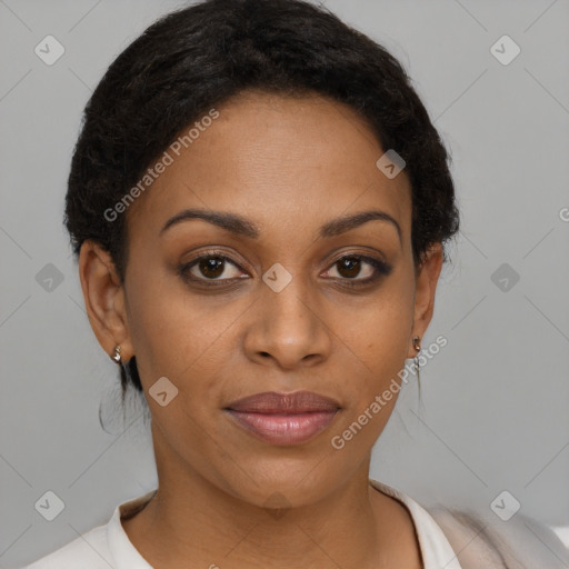 Joyful black young-adult female with short  brown hair and brown eyes