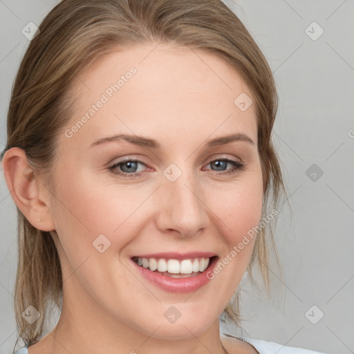 Joyful white young-adult female with medium  brown hair and blue eyes