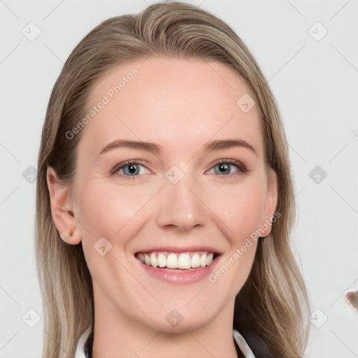 Joyful white young-adult female with long  brown hair and blue eyes