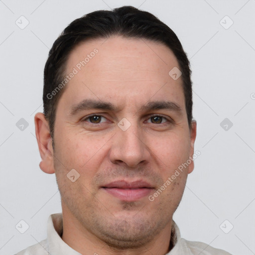 Joyful white adult male with short  brown hair and brown eyes