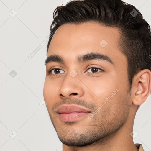 Joyful white young-adult male with short  black hair and brown eyes