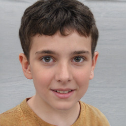 Joyful white child male with short  brown hair and brown eyes