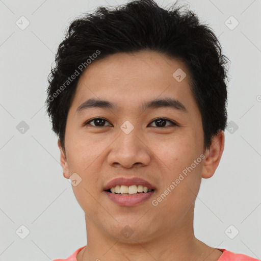 Joyful asian young-adult male with short  brown hair and brown eyes